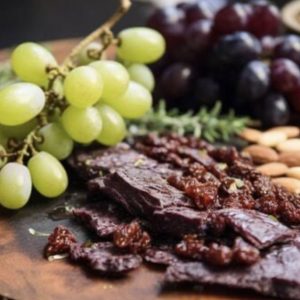 Platter Biltong & Grapes Nuts & Dip sauce with wooden board
