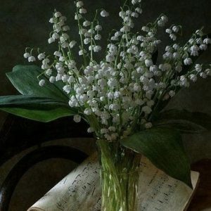 Glass Vase with Tiny white flowers and greenery